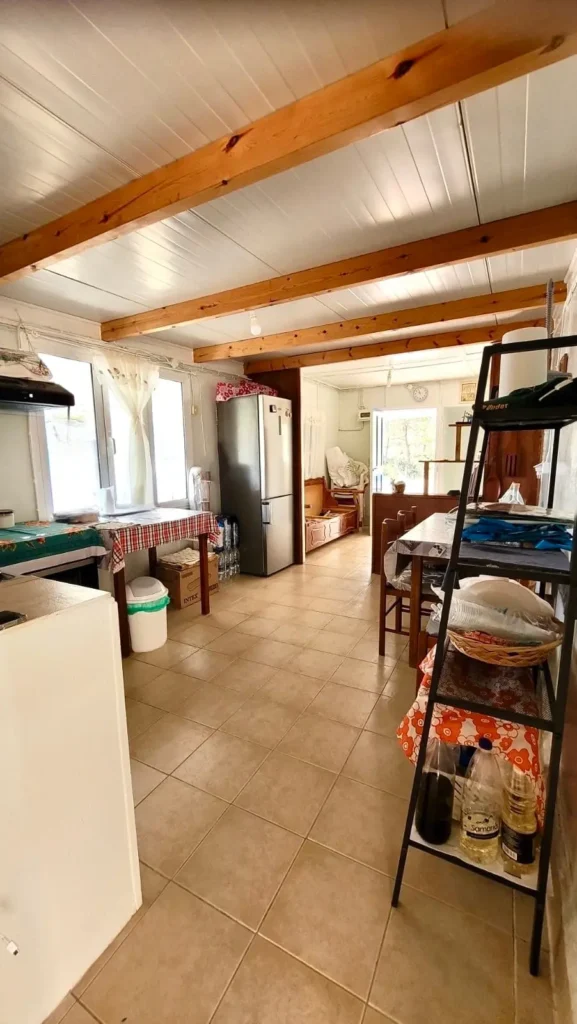 Fully equipped kitchen and dining area at Sylvia House accommodation on Telendos Island
