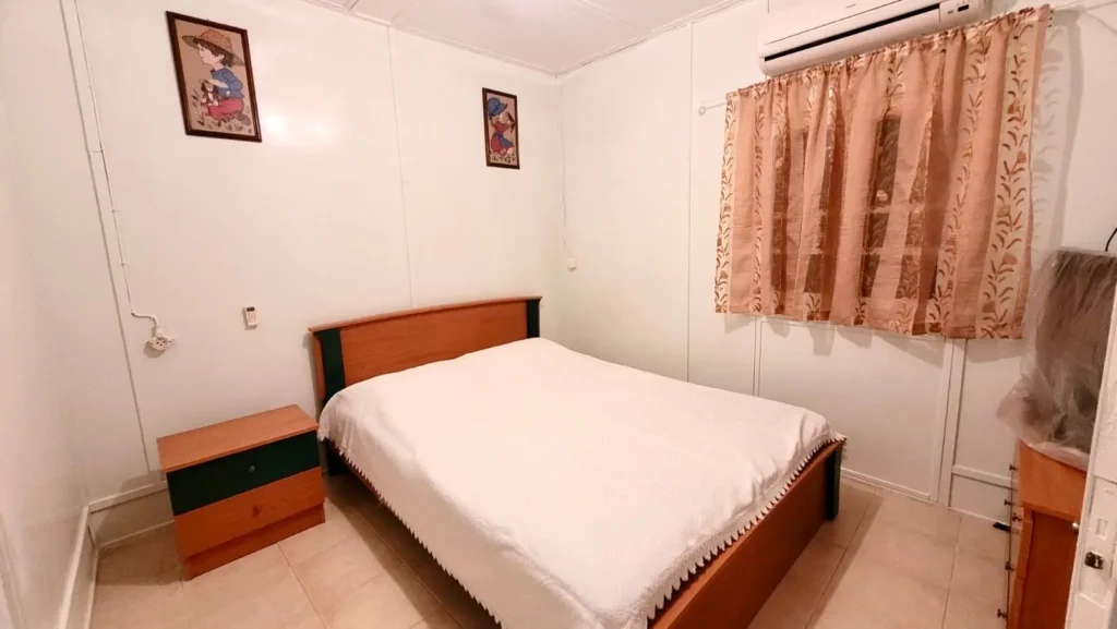 Spacious double bedroom with air conditioning and comfortable bed at Sylvia House Telendos